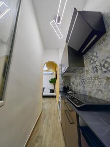 a kitchen with a sink and a counter top at La suite (Sole) in Lido di Pomposa