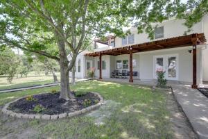 a house with a tree in the yard at Spacious Kemp Home with Private Pool and Guest House! in Kemp
