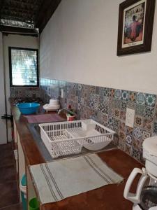 a kitchen with a sink and a counter top at Bungalow La Media Luna Brisas de Zicatela in Brisas de Zicatela +39 photos