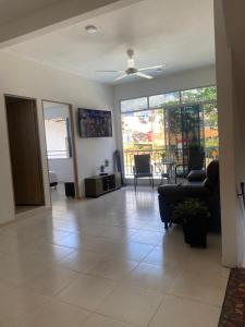a living room with a couch and a table at Casa Hawai in Melgar