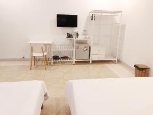 TV a/nebo společenská místnost v ubytování Philip Bungalow