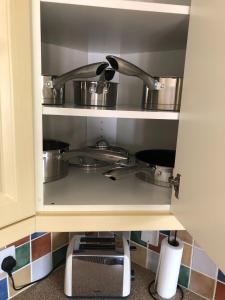 a kitchen with a sink and a faucet at The Burnham House in Bath