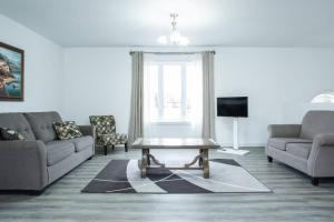 a living room with a couch and a coffee table at Nature's Retreat in Latchford