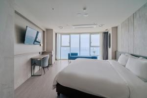 Postel nebo postele na pokoji v ubytování Hotel Aqua Palace