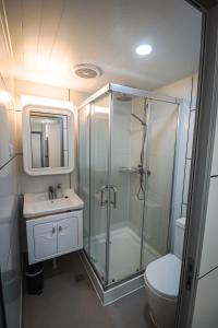 a bathroom with a shower and a sink and a toilet at Norwesta Lifestyle Park in Carnarvon