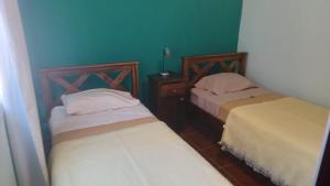 Un pat sau paturi într-o cameră la DEPARTAMENTO CAROLA