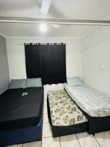 Een bed of bedden in een kamer bij Kit Net Santa Cruz