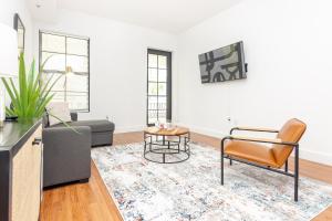 a living room with a couch and a chair at Miami Downtown 2 Bedrooms Apartment - 10 minutes to Beach - 5 minutes to Wynwood in Miami