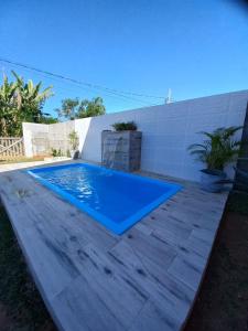 a swimming pool in the middle of a patio at Chalé Penedo Charmosa in Penedo