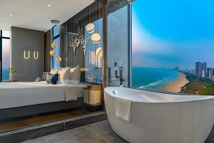 Voodi või voodid majutusasutuse Peninsula Hotel Danang toas