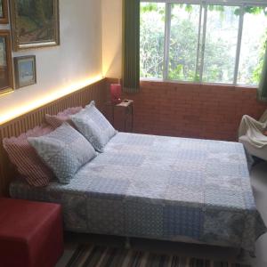 Cama ou camas em um quarto em Sítio Sapiranga