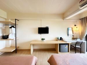 TV a/nebo společenská místnost v ubytování I-Home Residence and Hotel