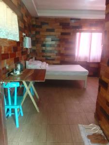 Postel nebo postele na pokoji v ubytování Woodland Inn