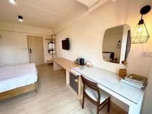 Postel nebo postele na pokoji v ubytování I-Home Residence and Hotel