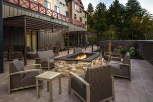 an outdoor patio with chairs and a fire pit at Courtyard by Marriott Olympia in Olympia