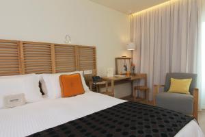 Ένα ή περισσότερα κρεβάτια σε δωμάτιο στο Golden Age Athens Hotel
