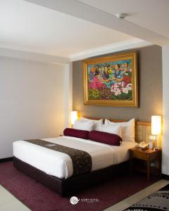 Postel nebo postele na pokoji v ubytování Ivory Hotel Bandung