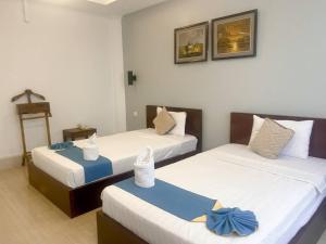 Best Central Point Hotel客房内的一张或多张床位