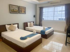 Best Central Point Hotel客房内的一张或多张床位