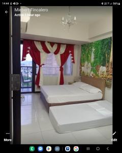 Postel nebo postele na pokoji v ubytování MANILABAY HOME + 21 fotografií