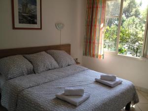 Postel nebo postele na pokoji v ubytování Hôtel De La Mer