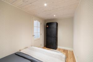 a bedroom with a bed in a room with a window at Posti studio apartment in Paide