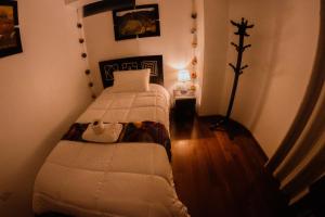 Voodi või voodid majutusasutuse Qolmay Hostel Cusco toas