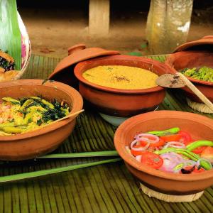 a group of bowls of food on a table at Pahiyan huts 