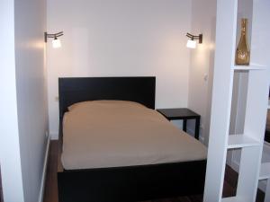 Postel nebo postele na pokoji v ubytování Studio in Kaunas City