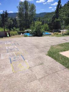 a parking lot with some writing on the ground at Villa Patty in Pian di Mulino