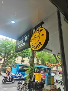 a sign for a subway store on a city street at Boulevard Rollandes house in Hanoi