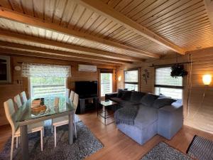 a living room with a couch and a table at Casa Aura in Aura