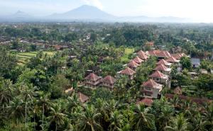 an aerial view of a resort town with palm trees at Sakti Garden Resort & Spa in Ubud