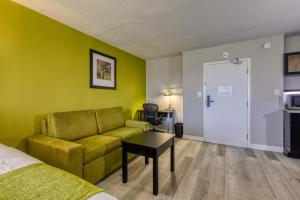 a living room with a couch and a table at Hotel Weston in Marietta