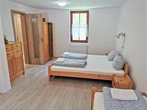 Postel nebo postele na pokoji v ubytování Penzion Liškův Mlýn