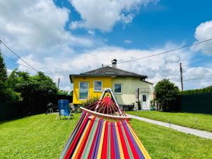 a large colorful baseball bat in front of a house at Ferienhaus Sausalblick in Großklein