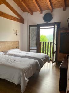 Postel nebo postele na pokoji v ubytování Apartamentos Rurales Casa Lafuente