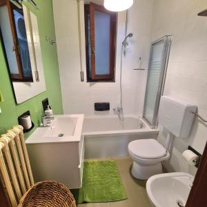 a bathroom with a toilet and a tub and a sink at Lovely House in Santa Margherita Ligure +32 photos