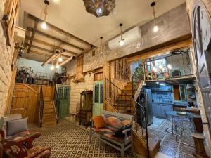 a living room with a couch and a table at Alf leila wa leila boutique in Haifa