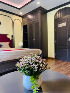 Postel nebo postele na pokoji v ubytování Moonlight Hotel Sa Pa
