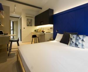 Postel nebo postele na pokoji v ubytování Coliwoo Keppel - CoLiving