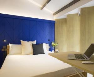 Postel nebo postele na pokoji v ubytování Coliwoo Keppel - CoLiving