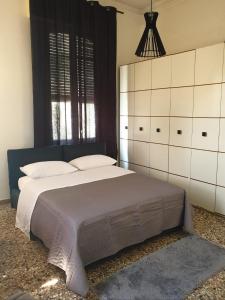 a bedroom with a large bed and a window at Angolo Relax Camere king in Rimini