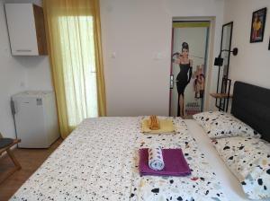 Postel nebo postele na pokoji v ubytování Apartment and Room Bonefacic