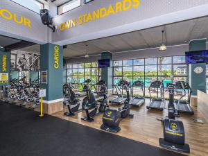 a gym with treadmills and cardio equipment in a building at 1254 The Blyde Crystal Clear 3 Bedroom Garden Apartment in Pretoria
