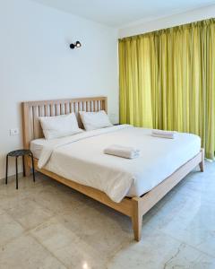 En eller flere senge i et værelse på Fig House Anjuna-Chapora Road , Siolim 1BHK Suite