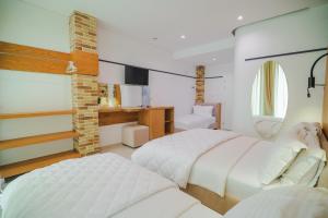 Postel nebo postele na pokoji v ubytování Hotel Piccolino