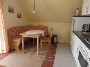 a living room with a table and a couch at Ferienwohnung Machate in Bad Bevensen