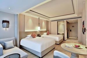 Letto o letti in una camera di SSAW Boutique Hotel Yingyang