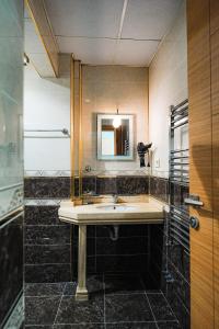 a bathroom with a sink and a mirror at Reyyan Hotel in Istanbul
